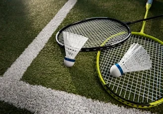 Badminton concept with shuttlecock and rackets